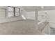 Bright bonus room features a window with blinds, neutral carpeting, and white-painted walls at 107 Four Iron Dr, Summerville, SC 29483