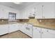 Clean kitchen features bright white cabinetry, tile countertops, and modern appliances at 107 Four Iron Dr, Summerville, SC 29483