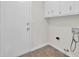 Functional laundry room with access to the outside, cabinetry and hookups at 107 Four Iron Dr, Summerville, SC 29483