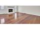 Spacious living room featuring a decorative fireplace and hardwood flooring at 107 Four Iron Dr, Summerville, SC 29483