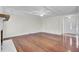 Inviting living room with beamed ceiling, hardwood floors, and a traditional fireplace at 107 Four Iron Dr, Summerville, SC 29483
