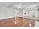 Large living room with hardwood floors and a view into the adjacent kitchen space at 107 Four Iron Dr, Summerville, SC 29483