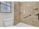 Shower featuring a built-in seat, grab bar, shower caddy, and marble walls at 107 Four Iron Dr, Summerville, SC 29483