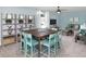 Spacious rec room with an entertainment area, large table, and carpet flooring at 118 Royal Cainhoy Way, Huger, SC 29450