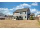 Large backyard with a spacious patio and a well-maintained lawn at 126 Lakelyn Rd, Moncks Corner, SC 29461