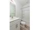 Bright bathroom with a white vanity, toilet and tub/shower combination with a shower curtain rod at 126 Lakelyn Rd, Moncks Corner, SC 29461