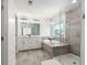 A stylish bathroom features double sinks, soaking tub, and glass enclosed shower at 126 Lakelyn Rd, Moncks Corner, SC 29461