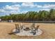 Backyard firepit with seating for outdoor gatherings and enjoying the evening at 126 Lakelyn Rd, Moncks Corner, SC 29461