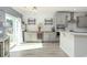 Well-lit kitchen featuring stainless steel appliances, sleek gray cabinets, and a wine refrigerator at 126 Lakelyn Rd, Moncks Corner, SC 29461