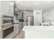 Well-appointed kitchen with stainless steel appliances, quartz countertops, and convenient pantry at 126 Lakelyn Rd, Moncks Corner, SC 29461