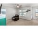 Cozy living room features a comfortable recliner, large windows and a ceiling fan at 126 Lakelyn Rd, Moncks Corner, SC 29461