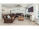 Cozy living room featuring a ceiling fan, a comfortable L-shaped couch, and a decorative fireplace at 126 Lakelyn Rd, Moncks Corner, SC 29461