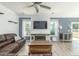 Bright living room with a rustic wooden coffee table, an entertainment center, and ample natural light at 126 Lakelyn Rd, Moncks Corner, SC 29461