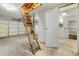 Basement with a ladder leading to the attic, offering additional storage and access at 1308 Coleridge St, Charleston, SC 29407