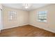 Inviting bedroom with hardwood floors, two windows and neutral paint, creating a peaceful atmosphere at 1308 Coleridge St, Charleston, SC 29407