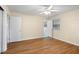 Comfortable bedroom with hardwood floors, a ceiling fan, and an ensuite bathroom at 1308 Coleridge St, Charleston, SC 29407