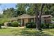 Charming brick home with a covered front porch and mature landscaping creating great curb appeal at 1308 Coleridge St, Charleston, SC 29407