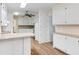 Open kitchen featuring white cabinets, stainless steel appliances, and lots of natural light at 1308 Coleridge St, Charleston, SC 29407