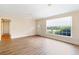 Bright living room with hardwood floors and a large window letting in natural light at 1308 Coleridge St, Charleston, SC 29407