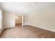 An open living room with hardwood floors and an open view into another room with a chandelier at 1308 Coleridge St, Charleston, SC 29407