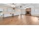 Comfortable living room with wood floors, white ceiling beams, a brick fireplace, and built-in cabinets at 1308 Coleridge St, Charleston, SC 29407