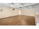 Open living room with wood floors, beamed ceiling and built in cabinets, ready for your personal design touch at 1308 Coleridge St, Charleston, SC 29407