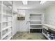 Storage room featuring shelves, a window for natural light, and a workbench at 1308 Coleridge St, Charleston, SC 29407