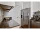 Bright kitchen features stainless steel appliances, granite countertops, and a convenient in-unit washer/dryer at 134 Marsh View Villas, Folly Beach, SC 29439