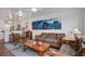 Cozy living room adjoining kitchen features comfortable seating, artwork, and a bright, open layout at 134 Marsh View Villas, Folly Beach, SC 29439