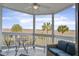 Covered patio showing table and chairs, outdoor sofa, and marsh views at 134 Marsh View Villas, Folly Beach, SC 29439