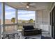 Covered patio featuring a table and chairs, plus a marsh view and ceiling fan at 134 Marsh View Villas, Folly Beach, SC 29439