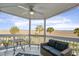 Picture of a covered patio with marsh views, featuring a table and chairs and a sofa at 134 Marsh View Villas, Folly Beach, SC 29439