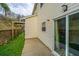 A view of the backyard showcasing a concrete patio and green space at 138 Hidden Palms Blvd, Summerville, SC 29485