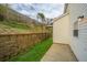 Backyard featuring a retaining wall and green space at 138 Hidden Palms Blvd, Summerville, SC 29485