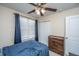 Comfortable bedroom with a ceiling fan, closet, and dresser offering ample storage and a calming atmosphere at 138 Hidden Palms Blvd, Summerville, SC 29485