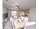 Bright dining room featuring stylish furnishings and decor with modern ceiling fan and natural lighting at 138 Hidden Palms Blvd, Summerville, SC 29485