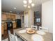 Open concept dining area featuring a cozy eat-in kitchen with wood floors and access to the living area at 138 Hidden Palms Blvd, Summerville, SC 29485