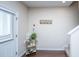 Inviting entryway features hardwood floors, coat hooks and a decorative display shelf with charming decor at 138 Hidden Palms Blvd, Summerville, SC 29485