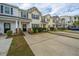 Street view of inviting townhomes showcasing curb appeal and landscaping at 138 Hidden Palms Blvd, Summerville, SC 29485