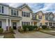 Townhomes showcasing their exteriors, landscaping, and ample parking space at 138 Hidden Palms Blvd, Summerville, SC 29485