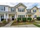 Inviting townhouse with a well-maintained lawn and charming front porch at 138 Hidden Palms Blvd, Summerville, SC 29485