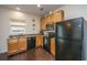 Well-equipped kitchen featuring stainless steel appliances, granite countertops, and ample wooden cabinet space at 138 Hidden Palms Blvd, Summerville, SC 29485