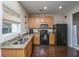 Efficient kitchen featuring modern appliances, granite countertops, and hardwood floors at 138 Hidden Palms Blvd, Summerville, SC 29485