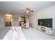Cozy living room with plush pink sofa, dining area, and ample natural light at 138 Hidden Palms Blvd, Summerville, SC 29485