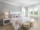 Inviting bedroom with neutral tones, natural light, plush carpet, and stylish furnishings at 138 Maritime Way, Summerville, SC 29485