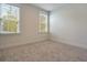 Bright, carpeted bedroom featuring white walls and two sunny windows with white trim at 138 Maritime Way, Summerville, SC 29485