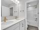 Modern bathroom features double vanity, sleek fixtures, and a shower-tub combo, ideal for relaxation at 139 Cantona Dr, Summerville, SC 29483