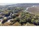 Overhead view of waterfront home surrounded by marsh and community at 1409 Dune Loft Villas, Seabrook Island, SC 29455