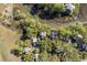 Birds-eye view of homes in a wooded neighborhood with a waterway. Arrow points to the home at 1409 Dune Loft Villas, Seabrook Island, SC 29455