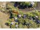 Aerial view of a neighborhood with waterfront homes surrounded by lush greenery and scenic waterways at 1409 Dune Loft Villas, Seabrook Island, SC 29455